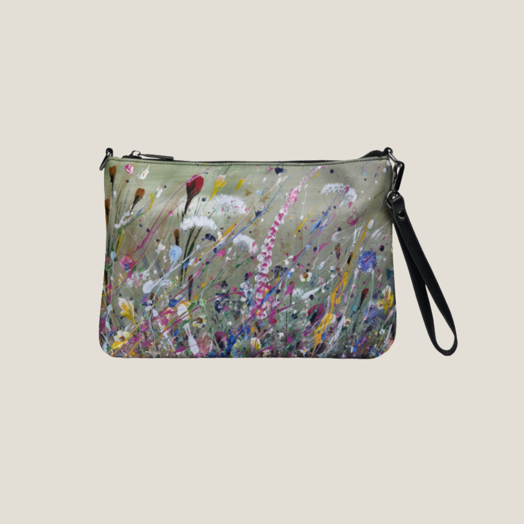 GLASARI Art Cross-Body Bag in Wind Swept Floral, a painted wildflower meadow in pink, white, yellow and blue on sage green, with wrist strap