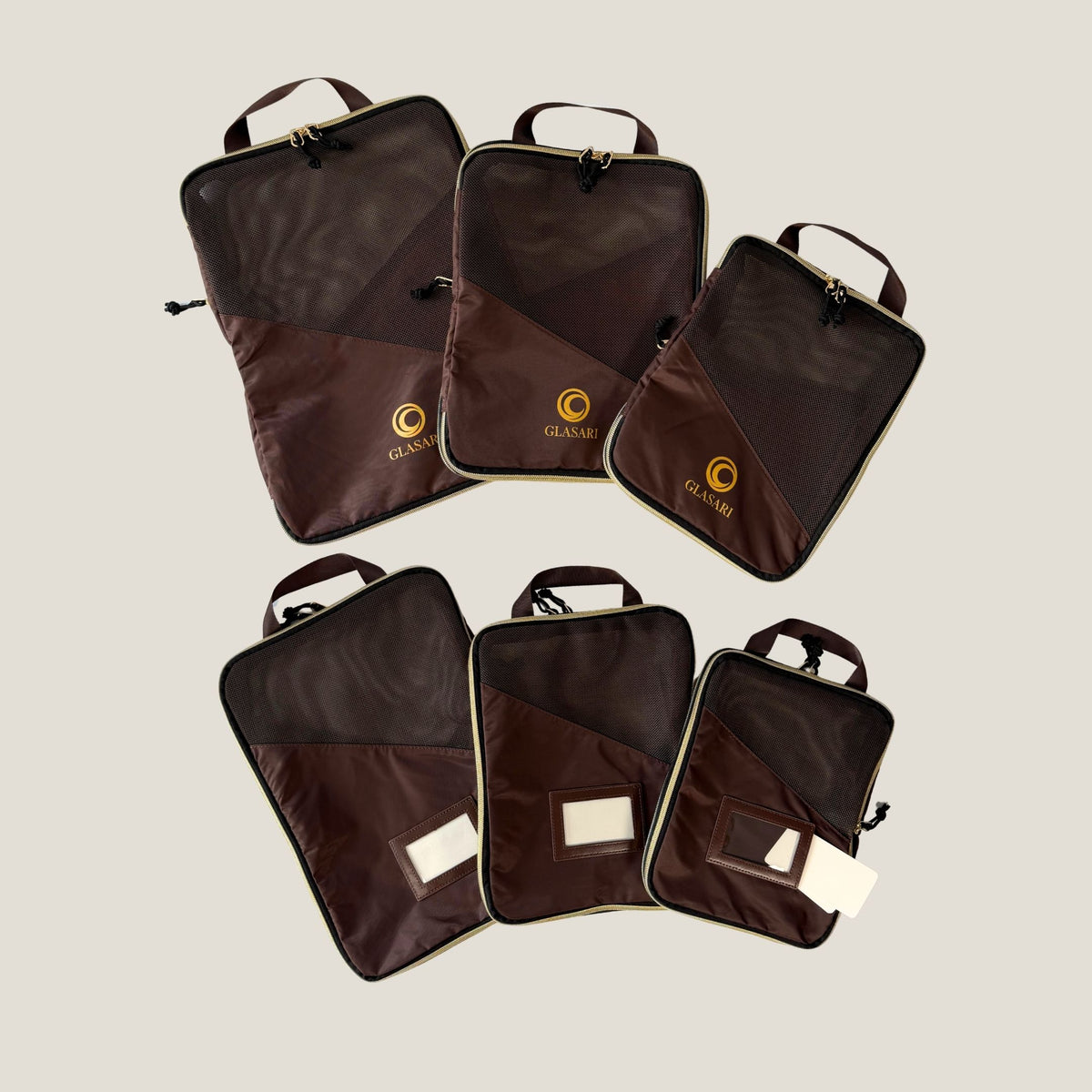 The three Compressi-Cubes in Cocoa Drift: small, medium and large, with breathable mesh panels and carry handles