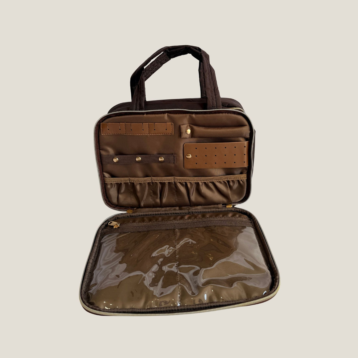GLASARI On-The-Glow Cosmetic Case in Cocoa Drift lying open, showing the jewellery section and clear zip pocket