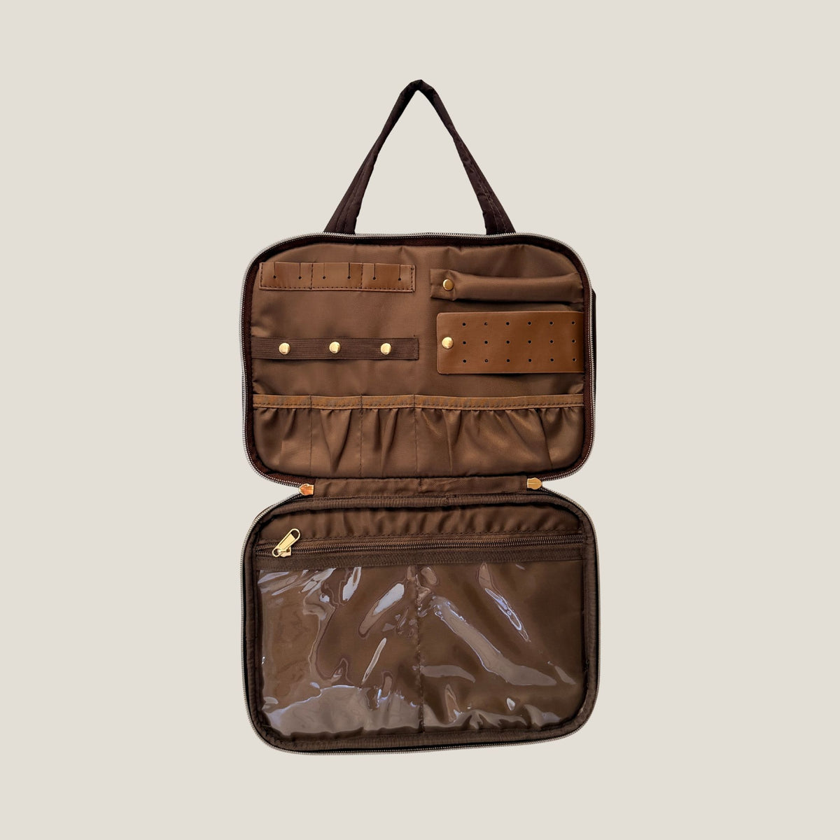 GLASARI On-The-Glow Cosmetic Case in Cocoa Drift standing open, showing the jewellery section with ring rolls, earring panel and clear zip pocket