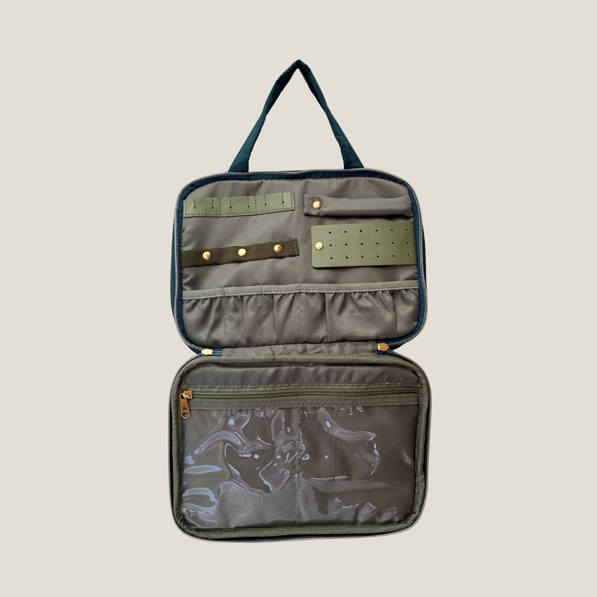 GLASARI On-The-Glow Cosmetic Case in Ocean Emerald standing open, showing the jewellery section with ring rolls, earring panel and clear zip pocket