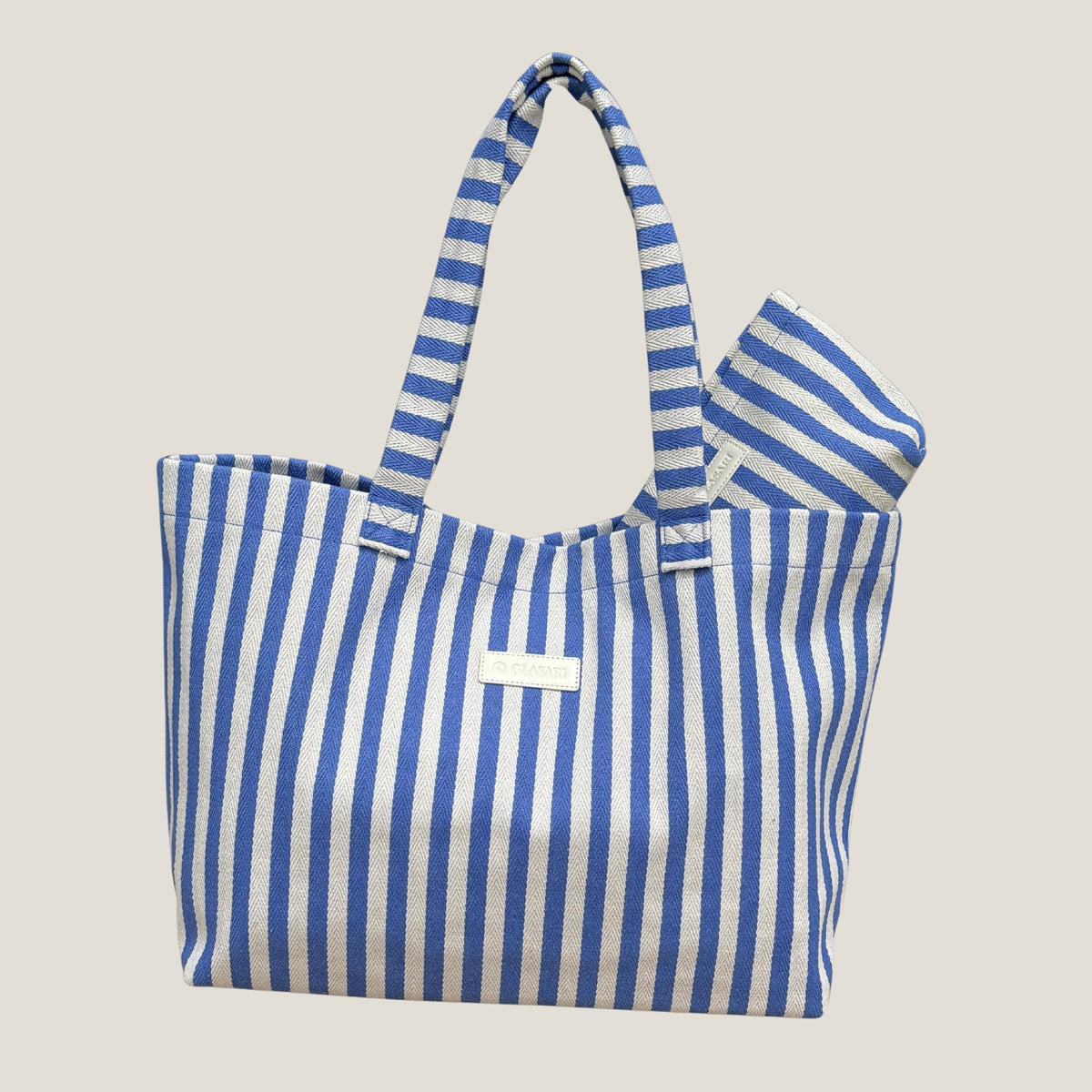 GLASARI Shore Tote in Ocean Blue Stripe with its matching pouch tucked inside, showing the blue and cream herringbone cotton weave